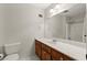 Bathroom featuring a white vanity with modern faucet and a large mirror reflecting the shower/tub combo at 587 Coast Oak Cir, Lawrenceville, GA 30046