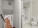 Bathroom with neutral walls, tile flooring and a shower-tub combo at 587 Coast Oak Cir, Lawrenceville, GA 30046