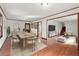 Open-concept living and dining area featuring hardwood floors, stylish furnishings, and abundant natural light at 587 Coast Oak Cir, Lawrenceville, GA 30046