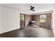 The living room has wood floors, a ceiling fan, a brick wall, and a vintage stove at 587 Coast Oak Cir, Lawrenceville, GA 30046