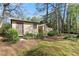 Two small outbuildings in the backyard area, surrounded by landscaping, providing storage and functionality at 587 Coast Oak Cir, Lawrenceville, GA 30046