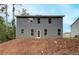 Backyard view of two-story house with gray siding at 1097 Bodega Loop, Locust Grove, GA 30248