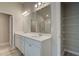 Bathroom featuring a double vanity, large mirror and access to the walk-in shower at 1097 Bodega Loop, Locust Grove, GA 30248