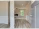 Welcoming entryway featuring light gray walls, white trim, and durable gray vinyl flooring at 1097 Bodega Loop, Locust Grove, GA 30248