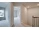 Hallway with neutral walls and carpet leads to another room at 1097 Bodega Loop, Locust Grove, GA 30248