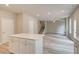 Spacious living room open to the kitchen featuring sleek flooring and modern lighting at 1097 Bodega Loop, Locust Grove, GA 30248