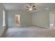 Large Primary bedroom with vaulted ceiling, ceiling fan, and ensuite access at 1097 Bodega Loop, Locust Grove, GA 30248