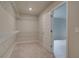 Walk-in closet with adjustable shelving and lighting at 1097 Bodega Loop, Locust Grove, GA 30248