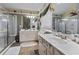 Bathroom featuring double sink vanity, walk-in shower, and ample counter space at 126 Cottage Club Dr, Locust Grove, GA 30248