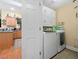 Convenient laundry room featuring a washer, dryer, and storage cabinets at 126 Cottage Club Dr, Locust Grove, GA 30248