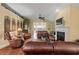 Bright and airy living room features a fireplace, hardwood floors, and vaulted ceilings at 126 Cottage Club Dr, Locust Grove, GA 30248