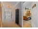View into the spacious main bedroom with a ceiling fan and warm, inviting decor and furnishings at 126 Cottage Club Dr, Locust Grove, GA 30248