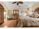 Inviting primary bedroom with hardwood floors, ceiling fan and access to outdoor area at 126 Cottage Club Dr, Locust Grove, GA 30248