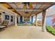 Charming outdoor patio with a pergola, ceiling fans, and comfortable seating at 126 Cottage Club Dr, Locust Grove, GA 30248