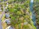 High angle view of a neighborhood near a river with green trees and well-manicured lawns at 1870 Chattahoochee Run Dr, Suwanee, GA 30024