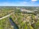 Scenic aerial view showcasing the neighborhood's proximity to a lush green space and a nearby highway at 1870 Chattahoochee Run Dr, Suwanee, GA 30024