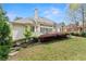 Spacious backyard with a well-maintained lawn and an expansive deck perfect for outdoor entertaining at 1870 Chattahoochee Run Dr, Suwanee, GA 30024