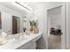 Bright bathroom with white cabinets, neutral walls, and decorative accents around the countertop sink at 1870 Chattahoochee Run Dr, Suwanee, GA 30024