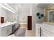 Bright bathroom features double vanity, soaking tub, and walk-in shower at 1870 Chattahoochee Run Dr, Suwanee, GA 30024