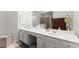 Bathroom with double sinks, quartz countertops, and stylish gold hardware at 1870 Chattahoochee Run Dr, Suwanee, GA 30024