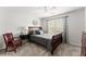 Bedroom with neutral colors, carpet, plantation shutters, and a ceiling fan at 1870 Chattahoochee Run Dr, Suwanee, GA 30024