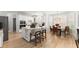 Bright, white kitchen featuring an island, stainless steel appliances, and hardwood flooring at 1870 Chattahoochee Run Dr, Suwanee, GA 30024