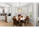 Breakfast nook with cozy rattan seating, chandelier, and adjacent to the kitchen at 1870 Chattahoochee Run Dr, Suwanee, GA 30024