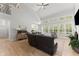 Bright, open living room with hardwood floors, large windows, and vaulted ceilings at 1870 Chattahoochee Run Dr, Suwanee, GA 30024
