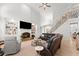 Bright living room featuring high ceilings, built-in shelves, a fireplace and hardwood floors at 1870 Chattahoochee Run Dr, Suwanee, GA 30024