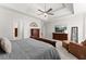 Spacious main bedroom with tray ceiling and sitting area at 1870 Chattahoochee Run Dr, Suwanee, GA 30024