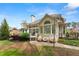 Charming home exterior with a deck, brick patio, and nicely landscaped yard, great for outdoor living at 1870 Chattahoochee Run Dr, Suwanee, GA 30024
