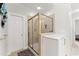 Shower with glass enclosure, tile surround and access to water closet at 1870 Chattahoochee Run Dr, Suwanee, GA 30024