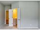 Hallway featuring open doorways to a bathroom and other rooms at 3871 Shelleydale Dr, Powder Springs, GA 30127