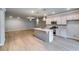 Open-concept living room and kitchen with stainless steel appliances and ample natural light at 3871 Shelleydale Dr, Powder Springs, GA 30127