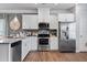 Modern kitchen featuring stainless steel appliances, granite countertops, and ample cabinet space at 147 Ravencliff Dr # 147, Austell, GA 30168