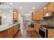 Modern kitchen with stainless appliances, granite countertops, plenty of counter space, and hardwood floors at 310 Kingspring Ct, Roswell, GA 30076