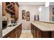 The bar features custom cabinetry, granite countertops, and a convenient sink for easy cleanup at 95 Nesbit Reserve Ct, Alpharetta, GA 30022