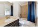 This bathroom offers tub and shower, marble countertop vanity and large window at 95 Nesbit Reserve Ct, Alpharetta, GA 30022