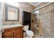 This is an updated bathroom with glass shower, granite counters, and cabinet space at 95 Nesbit Reserve Ct, Alpharetta, GA 30022