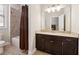 Well-lit bathroom featuring a vanity, tub and shower, and updated fixtures at 95 Nesbit Reserve Ct, Alpharetta, GA 30022