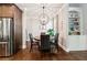 Breakfast nook featuring a modern light fixture, and built-in shelving at 95 Nesbit Reserve Ct, Alpharetta, GA 30022