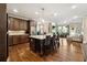 Spacious kitchen featuring an island, stainless steel appliances, and an open floor plan at 95 Nesbit Reserve Ct, Alpharetta, GA 30022