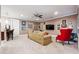 Finished basement living room has a TV, bar seating and comfortable furniture at 95 Nesbit Reserve Ct, Alpharetta, GA 30022