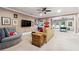 This basement living room includes a TV, sofa, and side table at 95 Nesbit Reserve Ct, Alpharetta, GA 30022