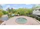 Pictureque aerial view of a water fountain and swimming pool surrounded by lush greenery and trees at 3101 Howell Mill Nw Rd # 301, Atlanta, GA 30327