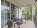 Relaxing balcony features seating and a view of the surrounding trees and greenery at 3101 Howell Mill Nw Rd # 301, Atlanta, GA 30327