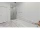 Bathroom featuring marble floors, a shower, and a separate soaking tub with elegant finishes at 3101 Howell Mill Nw Rd # 301, Atlanta, GA 30327