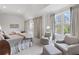 Bedroom with two beds, comfortable seating area, natural light, and calming decor at 3101 Howell Mill Nw Rd # 301, Atlanta, GA 30327