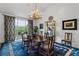 Formal dining room with a chandelier, a large area rug and access to the balcony at 3101 Howell Mill Nw Rd # 301, Atlanta, GA 30327