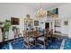 Bright dining room featuring a chandelier, stylish decor, and an adjacent butler's pantry at 3101 Howell Mill Nw Rd # 301, Atlanta, GA 30327